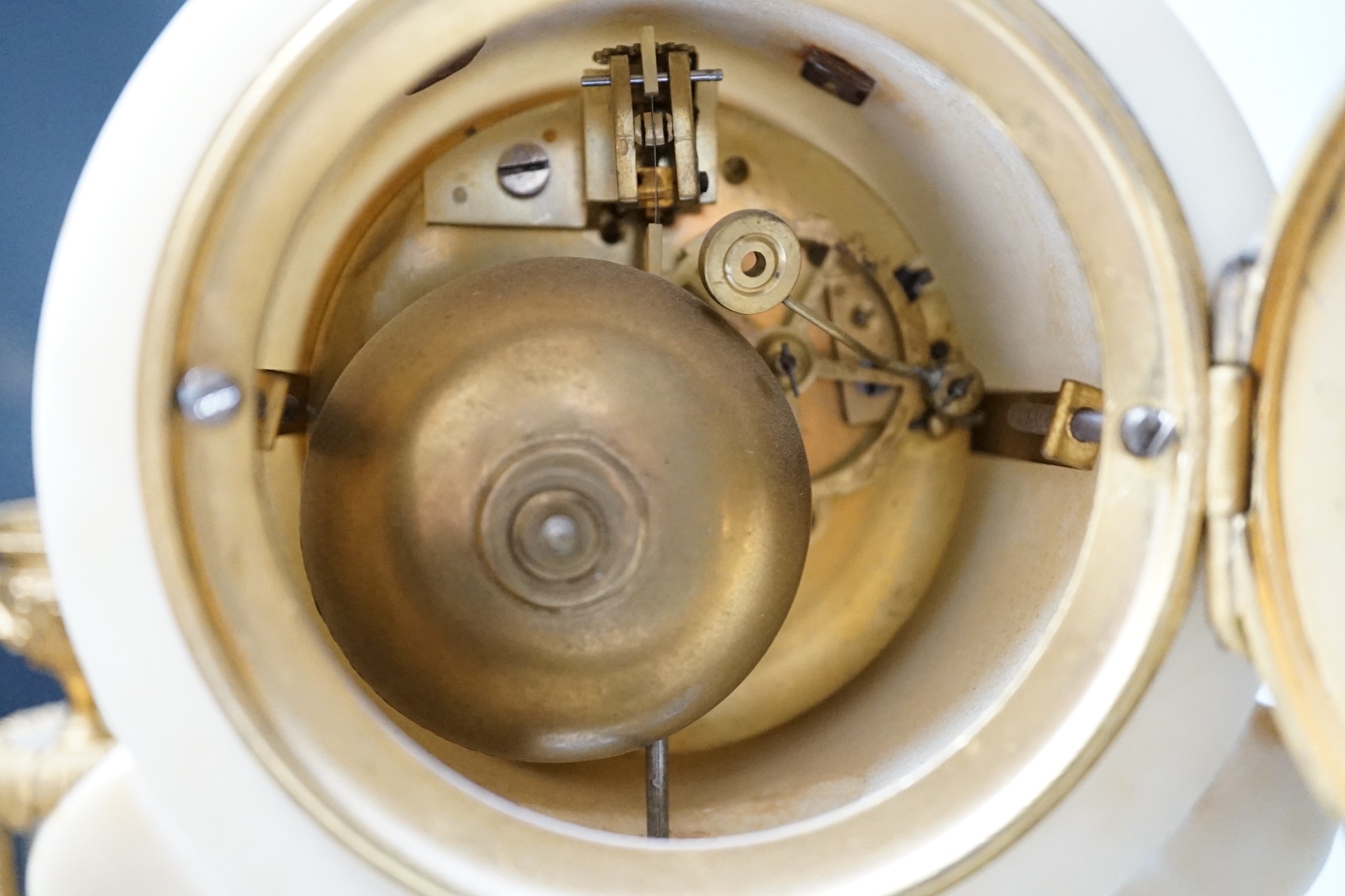 A 19th century alabaster clock garniture, 34cm